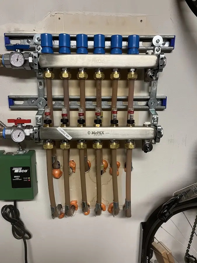 Plumber performing Water Heater Repair at a residential property in Tecumseh